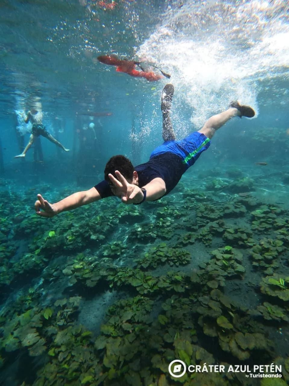 Travellers enjoying the turquoise waters of Crater Azul
